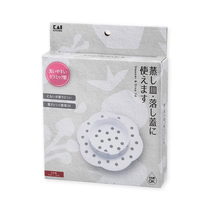 セラミック 蒸し器＆落し蓋のパッケージ。電子レンジ使用OK・においが移りにくい・食洗機OK・日本製と書かれている